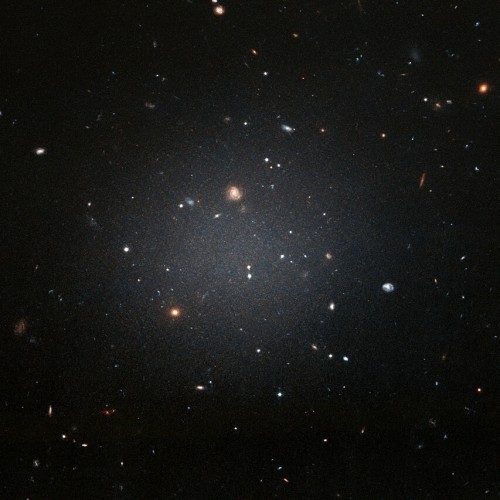 A picture of the ultra-diffuse galaxy NGC 1052-DF2, which is barely visible in the night sky.